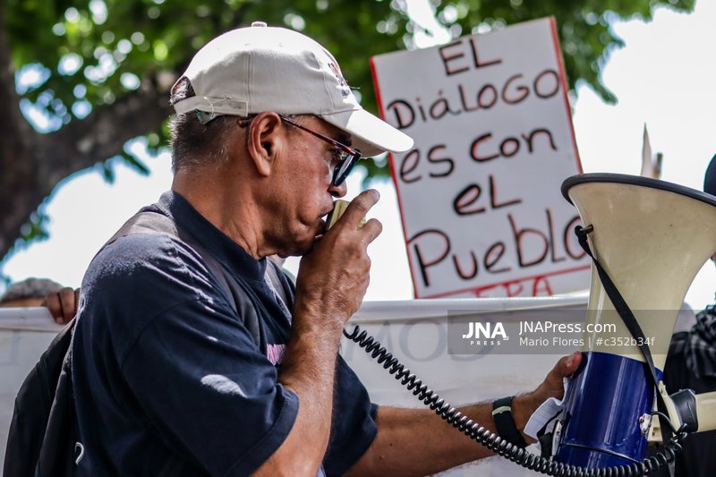 Protesters in Caracas demand transparency over oil agreement with United States
