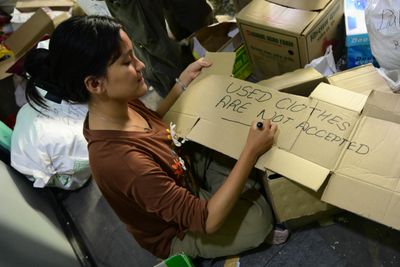 Volunteers prepare relief supplies for Nepal flood victims