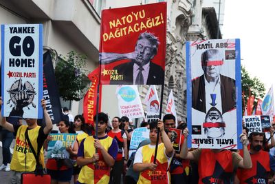 People protest against the NATO Summit in Istanbul