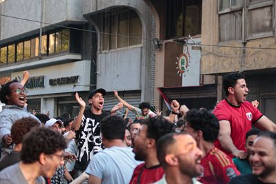 Egyptian fans watch the Egypt-Argentina match in the streets and squares 