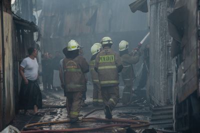 Firefighters battle factory blaze in East Jakarta