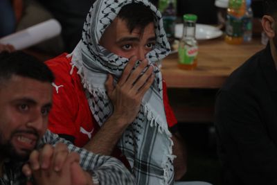 RAMALLAH, WEST BANK – JULY 7, 2026: Palestinian football fans react with disappointment after Egypt’s defeat to Argentina in the FIFA World Cup Round of 16, as they watched the match at a public venue in the city of Ramallah. Photo by Tariq Khamayseh / JNA Press.