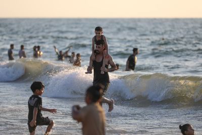 Palestinians seek relief from summer heat on Gaza beach