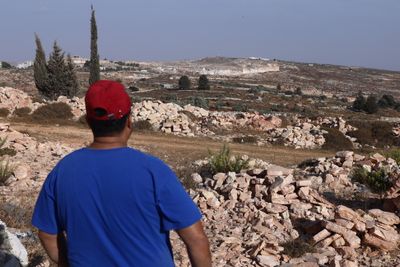 Israeli forces uproot hundreds of olive trees in Kafr Malik