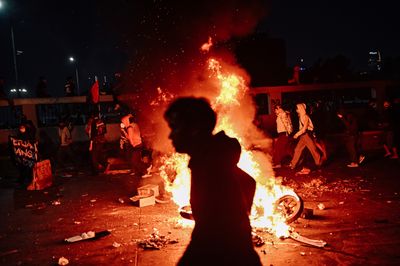 Protesters clash with security forces in Jakarta