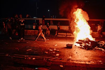 Protesters clash with security forces in Jakarta