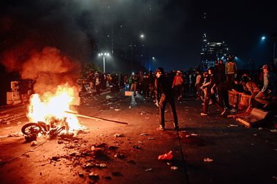 Protesters clash with security forces in Jakarta