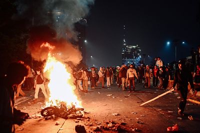 Protesters clash with security forces in Jakarta