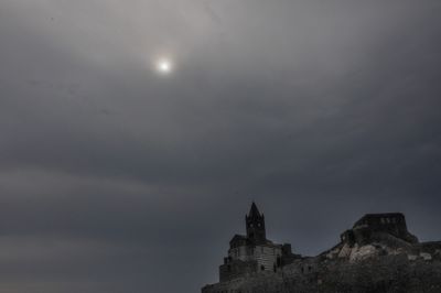 Storm clouds gather over Italy's Gulf of La Spezia after earthquake ahead of partial solar eclipse