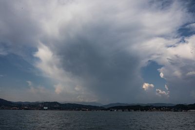 Storm clouds gather over Italy's Gulf of La Spezia after earthquake ahead of partial solar eclipse