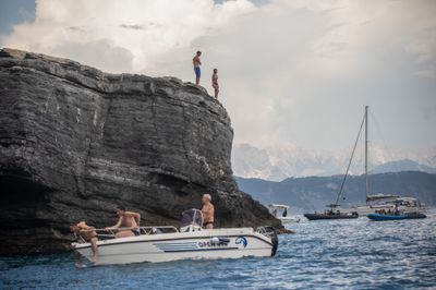 Storm clouds gather over Italy's Gulf of La Spezia after earthquake ahead of partial solar eclipse