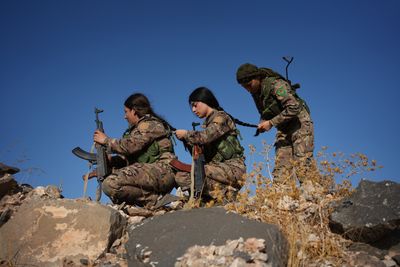 YPJ fighters in Kobane amid Syria’s military transition
