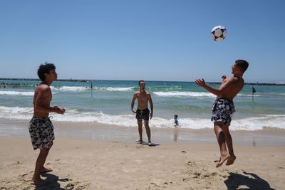 Israelis Flock to Tel Aviv Beach Amid Summer Heat