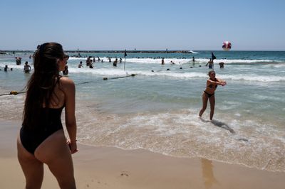 Israelis Flock to Tel Aviv Beach Amid Summer Heat