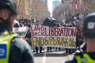 Counter-protesters clash with police during anti-immigration rally