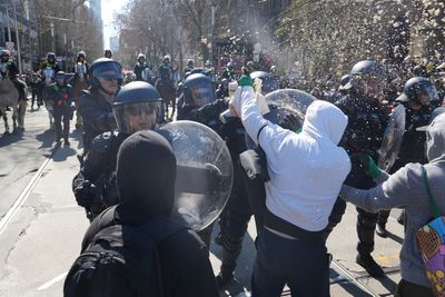 Counter-protesters clash with police during anti-immigration rally