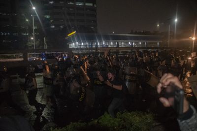 Police disperse protesters during demonstration in Jakarta