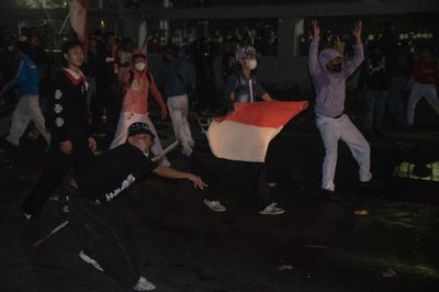 Police disperse protesters during demonstration in Jakarta