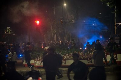 Police disperse protesters during demonstration in Jakarta